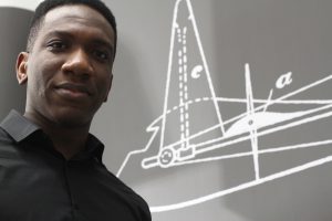 Osita Ugwueze with an outline of Fred Lanchester's 1897 Manned Aerial Machine in the Lanchester Interactive Archive