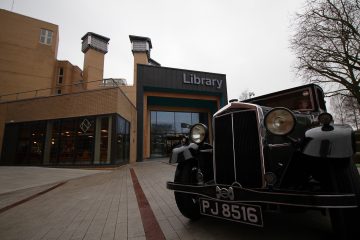 Outside Coventry University's Lanchester Library with the 1932 Lanchester car